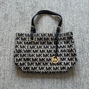 Michael Kors purse, black and tan color. Gently used.